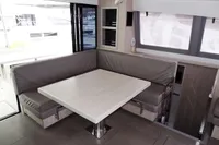 Interior of 2020 Leopard 43 Powercat with modern dining area and large windows.