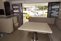 Interior of 2020 Leopard 43 Powercat yacht with modern seating and kitchenette.