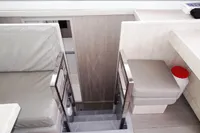 Interior of 2020 Leopard 43 Powercat, featuring modern seating and sleek stairway design.