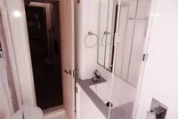 Modern bathroom interior on 2020 Leopard 43 Powercat yacht, featuring sleek fixtures and minimalist design.