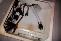 Bilge compartment of 2020 Leopard 43 Powercat with hoses and pump system.