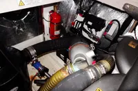 Engine room of 2020 Leopard 43 Powercat with fire extinguisher and mechanical components.