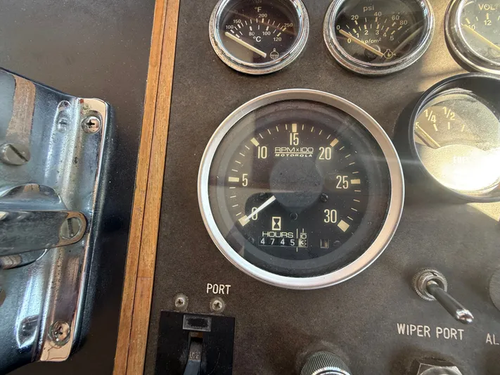 Aja Marie Yacht Photos Pics 1986 Marine Trader Tri Cabin dashboard with RPM and fuel gauges.