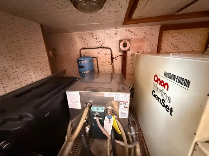 Aja Marie Yacht Photos Pics Engine room of 1986 Marine Trader Tri Cabin with Onan Marine GenSet.