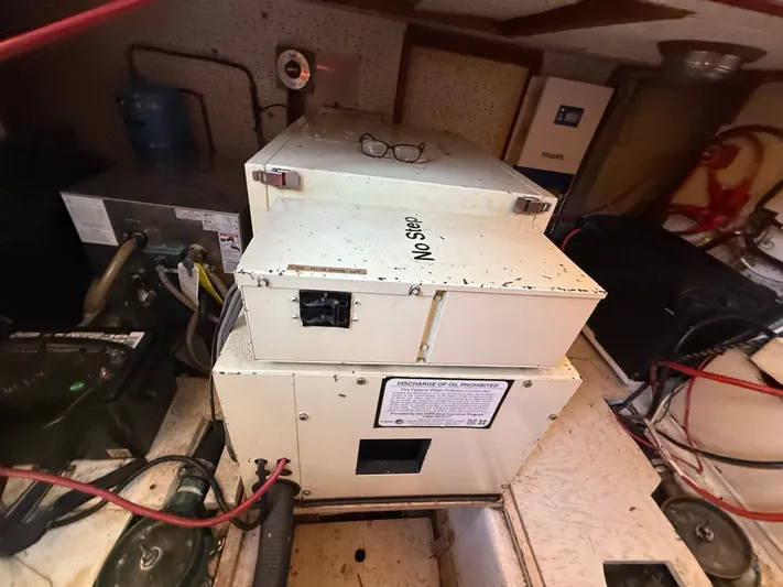 Aja Marie Yacht Photos Pics Engine room of 1986 Marine Trader Tri Cabin with equipment and wiring.