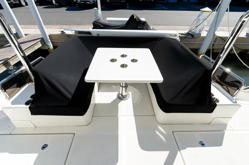  Yacht Photos Pics Aquila 44 Yacht 2023 with stylish deck area and table.