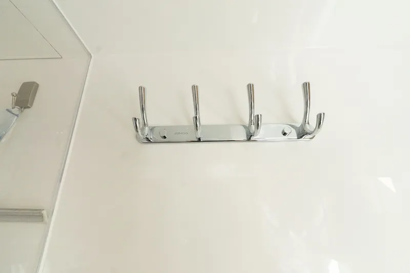  Yacht Photos Pics Chrome wall hooks in the bathroom of Aquila 44 Yacht 2023.