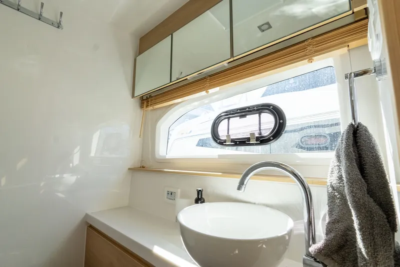  Yacht Photos Pics Interior of 2023 Aquila 44 Yacht with sink and window.