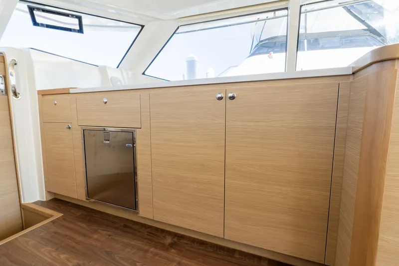  Yacht Photos Pics Interior of 2023 Aquila 44 Yacht with wooden cabinetry.