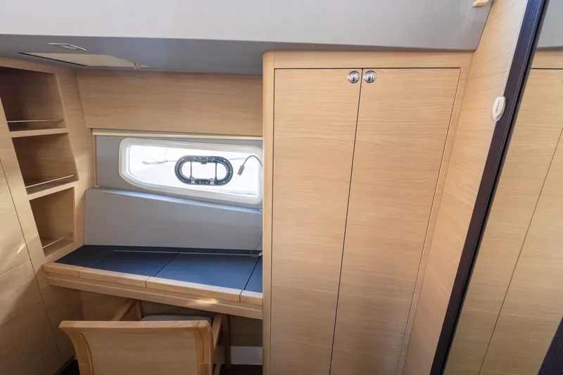  Yacht Photos Pics Interior of 2023 Aquila 44 Yacht with desk and window.
