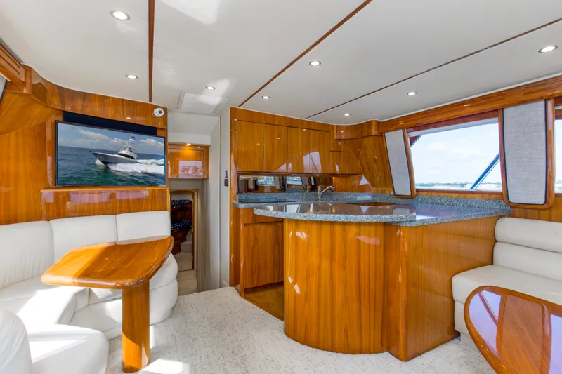 Reel Petty Yacht Photos Pics Luxurious interior of 2017 Viking 48 Convertible yacht with wood finishes and modern amenities.