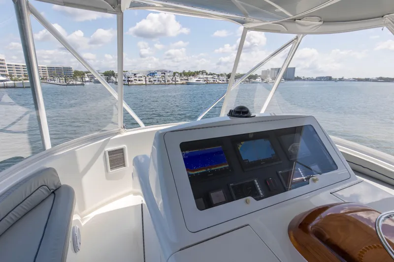 Reel Petty Yacht Photos Pics Helm of 2017 Viking 48 Convertible yacht with waterfront view.