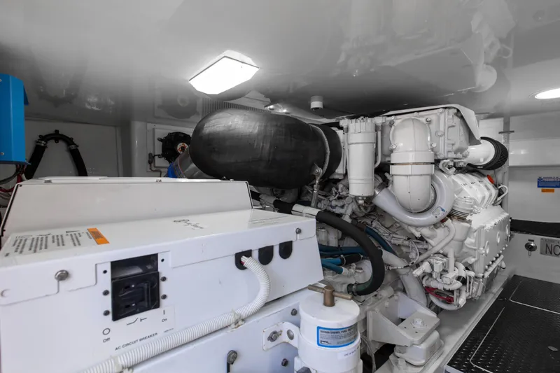 Reel Petty Yacht Photos Pics Engine room of 2017 Viking 48 Convertible yacht, showcasing machinery and components.