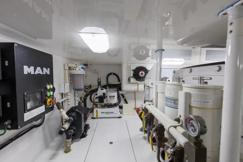 Reel Petty Yacht Photos Pics Engine room of 2017 Viking 48 Convertible yacht, featuring MAN equipment and various mechanical components.
