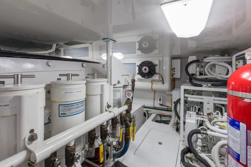 Reel Petty Yacht Photos Pics Engine room of 2017 Viking 48 Convertible yacht, featuring machinery and safety equipment.