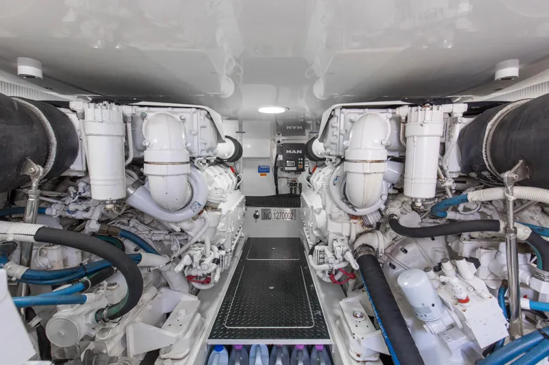 Reel Petty Yacht Photos Pics Engine room of 2017 Viking 48 Convertible yacht, showcasing dual engines and mechanical systems.