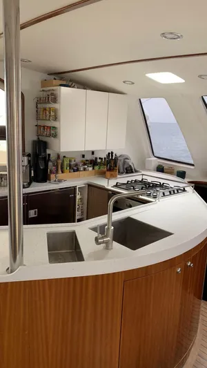 Mersea Yacht Photos Pics Modern kitchen interior on a 2001 Catana 582 yacht with ocean view.