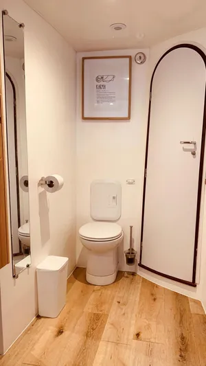 Mersea Yacht Photos Pics Modern bathroom in 2001 Catana 582 yacht with wooden flooring and sleek design.