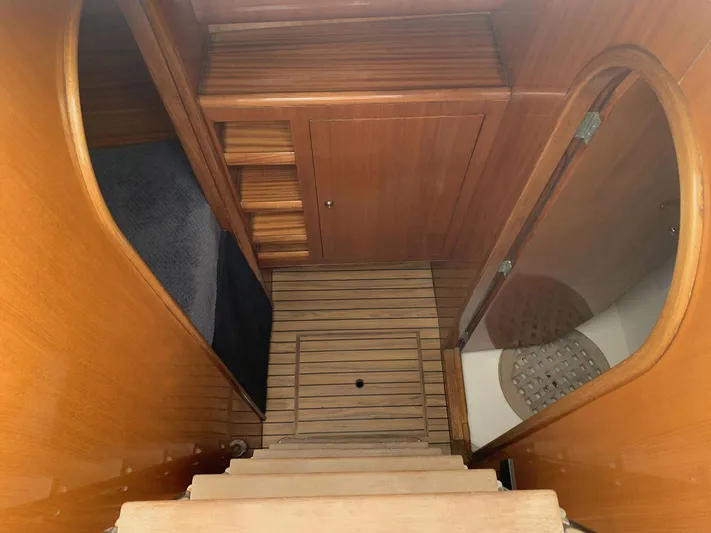 Mersea Yacht Photos Pics Interior of 2001 Catana 582 yacht with wooden stairs and cabinetry.