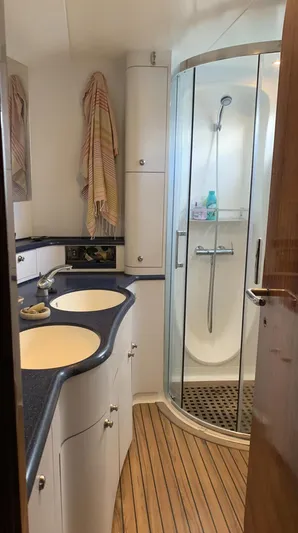 Mersea Yacht Photos Pics Bathroom in 2001 Catana 582 yacht with dual sinks and curved shower.