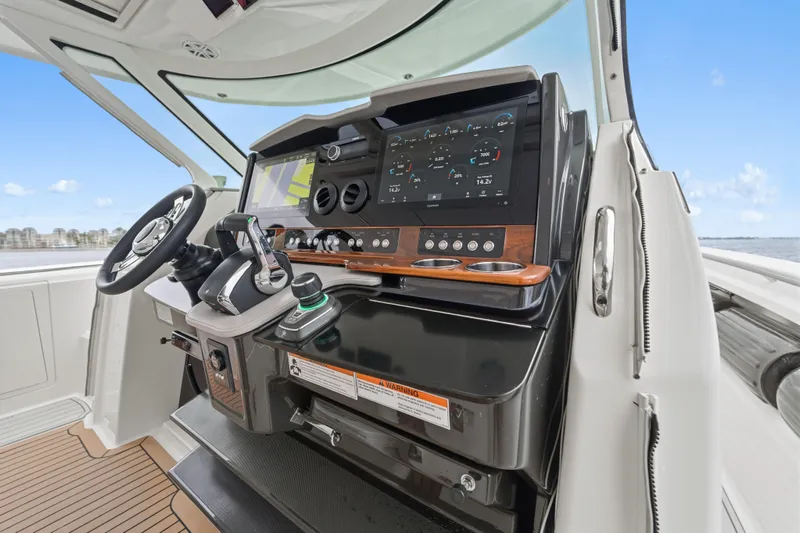 Twelve Yacht Photos Pics 2022 Tiara Sport 43 LS helm with advanced navigation controls and sleek design.