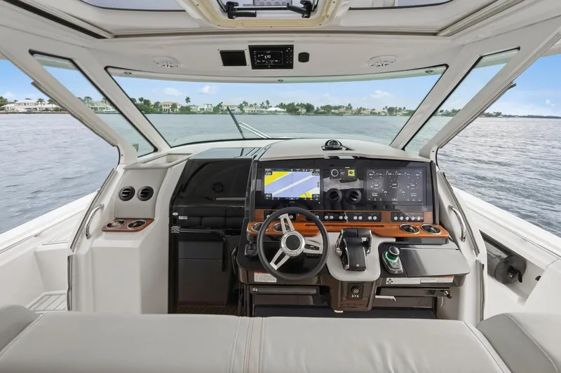 Twelve Yacht Photos Pics 2022 Tiara Sport 43 LS yacht cockpit with advanced navigation system and luxurious interior.