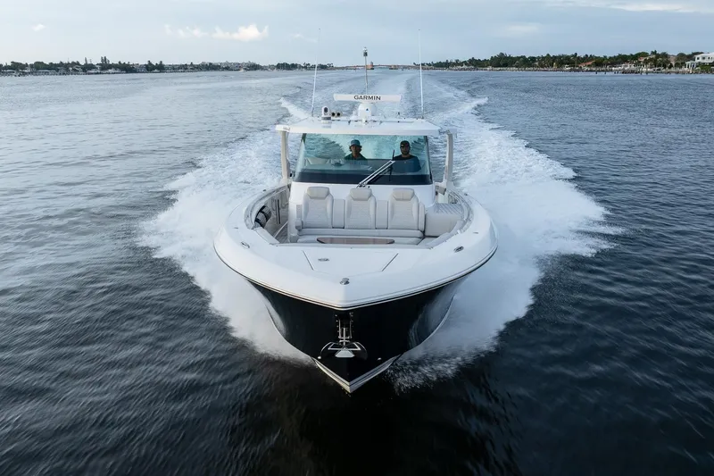 Twelve Yacht Photos Pics 2022 Tiara Sport 43 LS yacht cruising on open water.