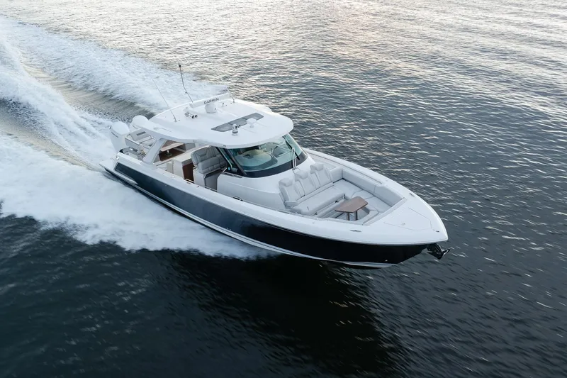 Twelve Yacht Photos Pics 2022 Tiara Sport 43 LS luxury yacht cruising on open water.