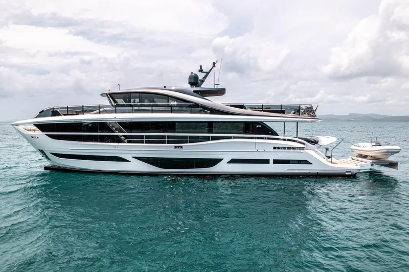 Hang Loose Yacht Photos Pics Luxurious 2021 Princess X95 yacht cruising on open sea under cloudy skies.