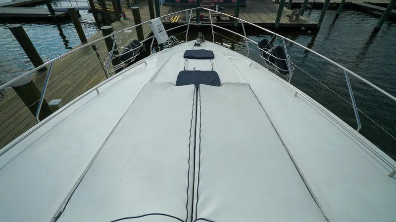 Laurie Lu Yacht Photos Pics Bow view of 2002 Viking Princess 68 yacht docked at marina.