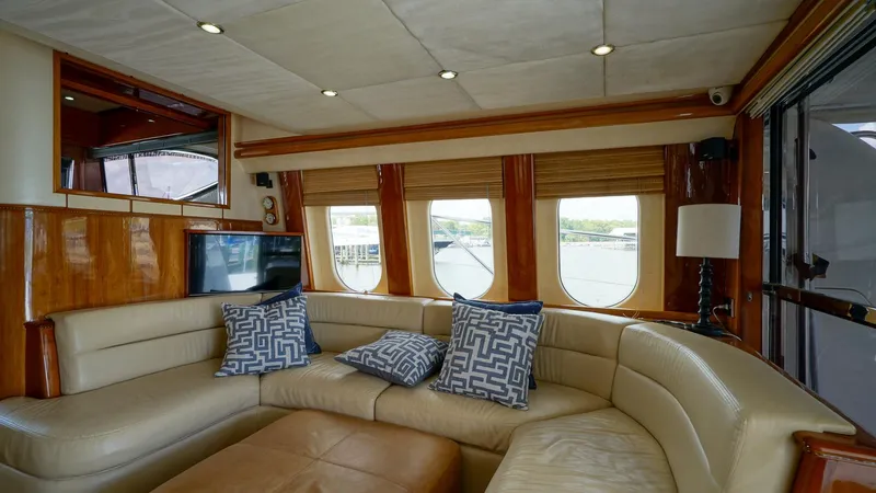 Laurie Lu Yacht Photos Pics Luxurious 2002 Viking Princess 68 yacht interior with plush seating and elegant decor.