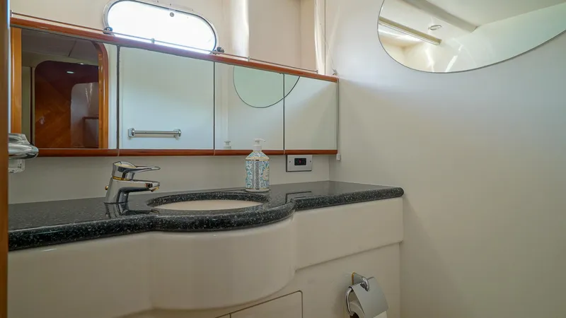 Laurie Lu Yacht Photos Pics Luxurious bathroom in 2002 Viking Princess 68 yacht with modern fixtures and elegant design.