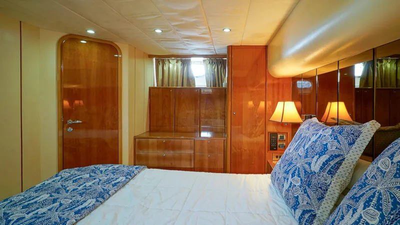 Laurie Lu Yacht Photos Pics Luxurious cabin interior of 2002 Viking Princess 68 Sport Cruiser with elegant wood finish.