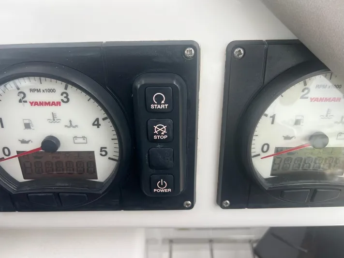 Win Win Yacht Photos Pics Control panel of a 2022 Leopard 50 with Yanmar engine gauges and buttons.