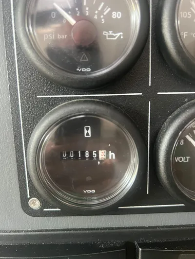 Win Win Yacht Photos Pics Close-up of Leopard 50 dashboard gauges, showing 185 hours.