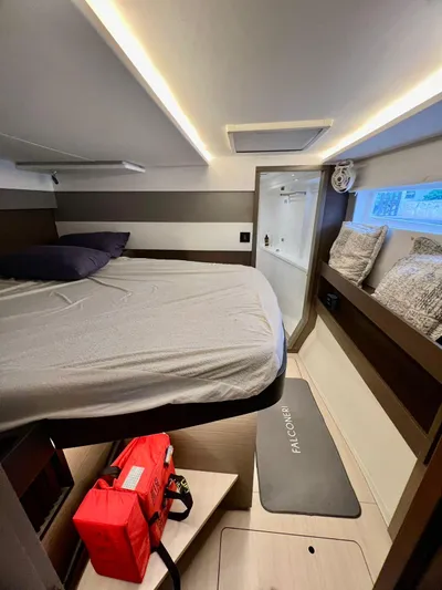 Win Win Yacht Photos Pics Modern Leopard 50 yacht cabin interior, 2022 model, featuring a cozy bed and stylish decor.
