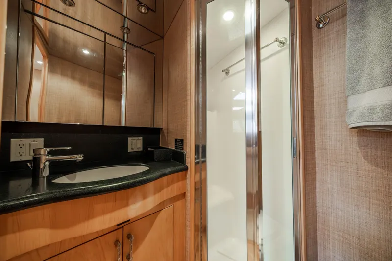 Wet Hooker Yacht Photos Pics Luxurious bathroom in 2003 Hatteras 60 Convertible yacht with modern fixtures and shower.