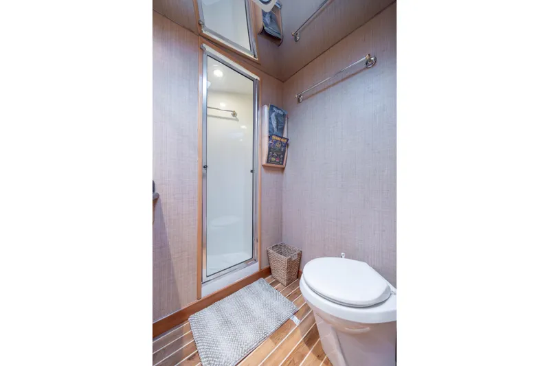 Wet Hooker Yacht Photos Pics Bathroom interior of 2003 Hatteras 60 Convertible yacht with shower and toilet.