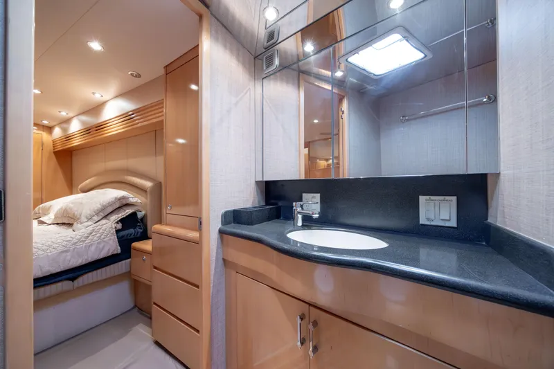 Wet Hooker Yacht Photos Pics Luxurious interior of 2003 Hatteras 60 Convertible yacht with bedroom and bathroom.