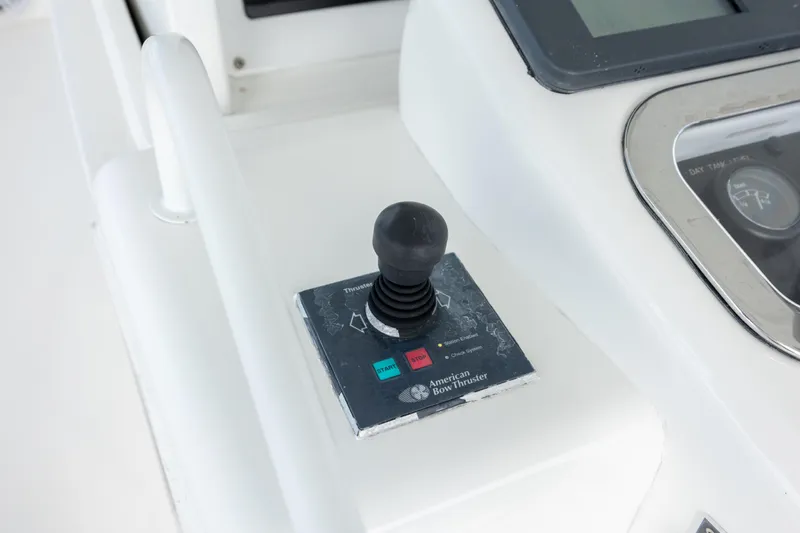 Wet Hooker Yacht Photos Pics Control panel of a 2003 Hatteras 60 Convertible yacht with joystick and display.