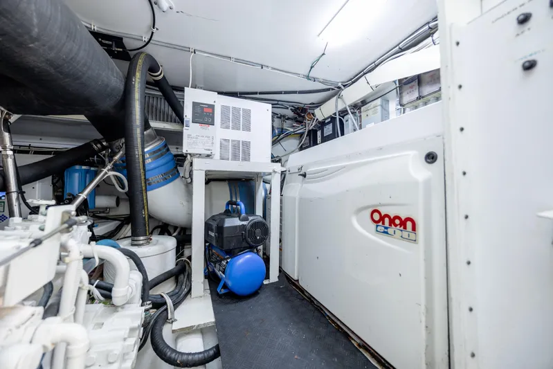 Wet Hooker Yacht Photos Pics Engine room of 2003 Hatteras 60 Convertible yacht with Onan generator.