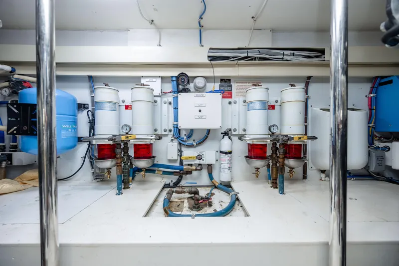 Wet Hooker Yacht Photos Pics Engine room of 2003 Hatteras 60 Convertible yacht with filtration systems and equipment.