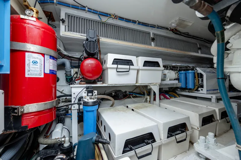 Wet Hooker Yacht Photos Pics Engine room of 2003 Hatteras 60 Convertible yacht with fire extinguisher and equipment.