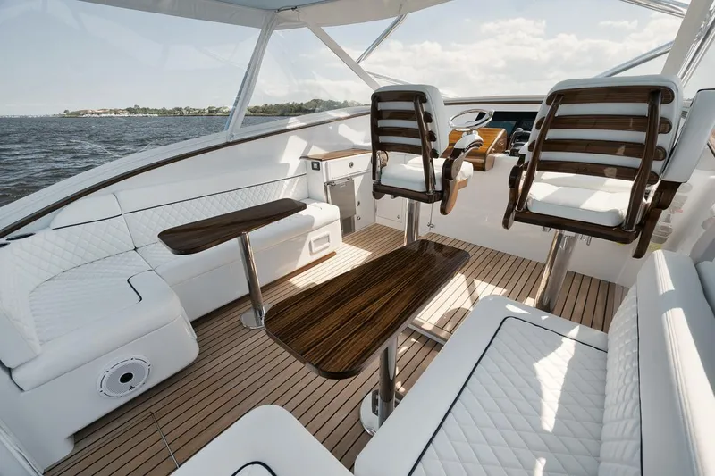 Slack Tide Yacht Photos Pics Gamefisherman 49 Slack Tide - Bridge Deck, Port and Starbard Seating, Release Marine Helm Tables