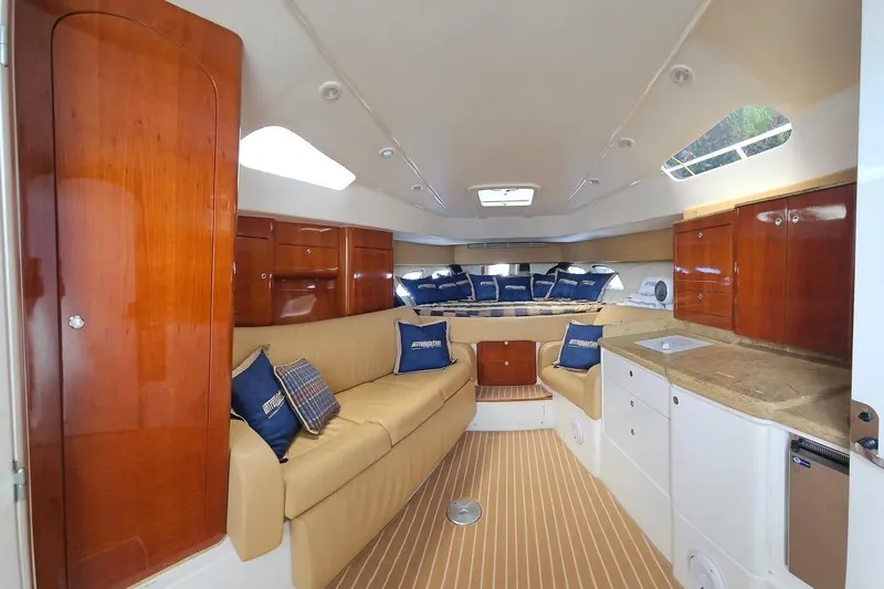 Intrepidation Yacht Photos Pics Luxurious interior of 2009 Intrepid 430 Sport Yacht with plush seating and elegant wood finishes.