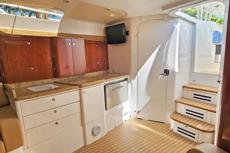 Intrepidation Yacht Photos Pics Interior of 2009 Intrepid 430 Sport Yacht with wooden cabinets and modern amenities.