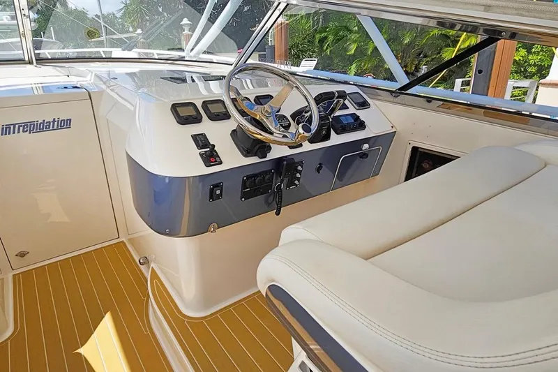 Intrepidation Yacht Photos Pics 2009 Intrepid 430 Sport Yacht helm with steering wheel and control panel.