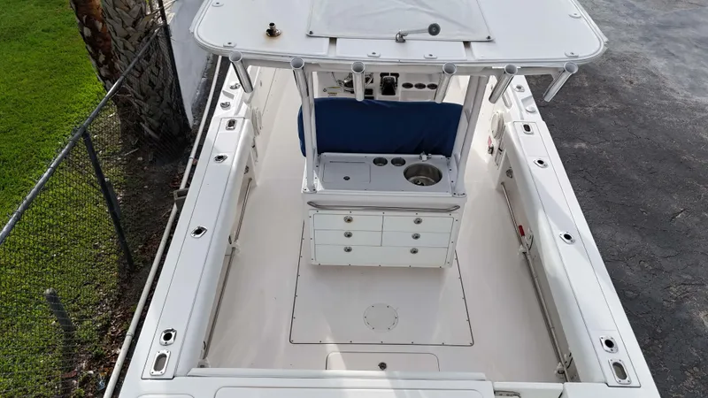  Yacht Photos Pics 2015 Edgewater 320CC boat interior, featuring spacious deck and center console.