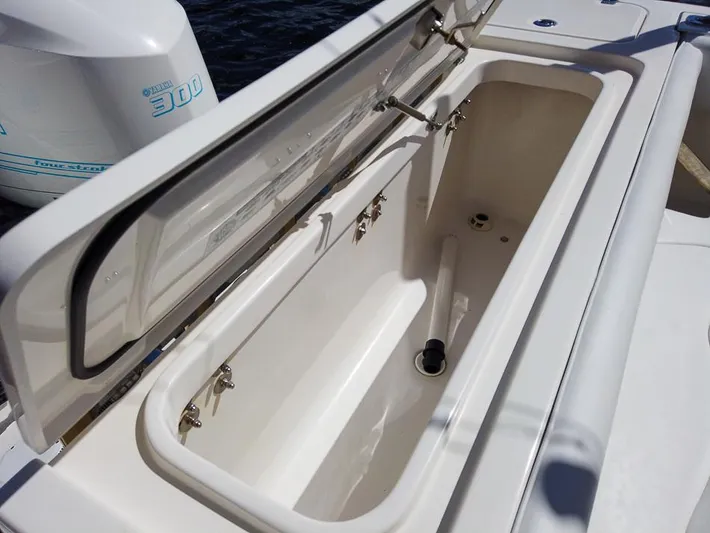  Yacht Photos Pics Open storage compartment on 2015 Edgewater 320CC boat with Yamaha 300 engine.