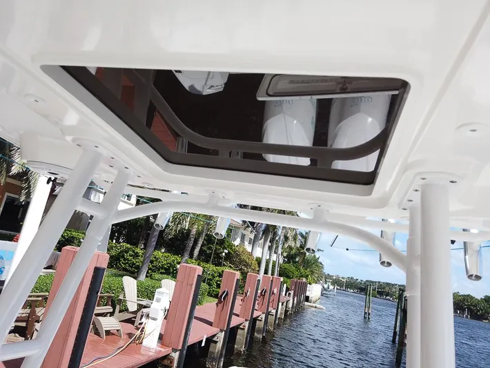  Yacht Photos Pics 2015 Edgewater 320CC boat detail with dockside view and palm trees.